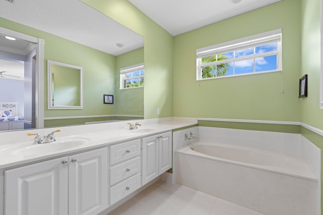 240 Honeysuckle Dr, Jupiter, FL 33458 - full bathroom with double vanity, tile patterned flooring, and a garden tub