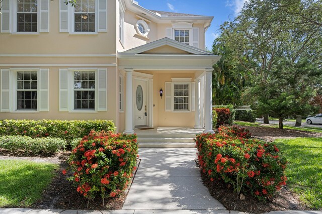 240 Honeysuckle Dr, Jupiter, FL 33458 - view of front of property with stucco siding
