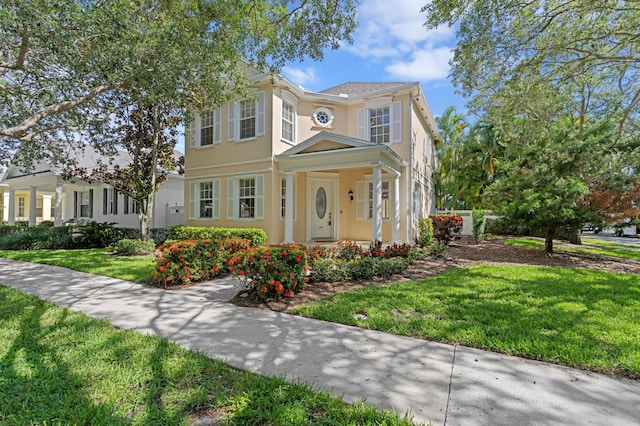 240 Honeysuckle Dr, Jupiter, FL 33458 - view of front of property featuring stucco siding and a front lawn