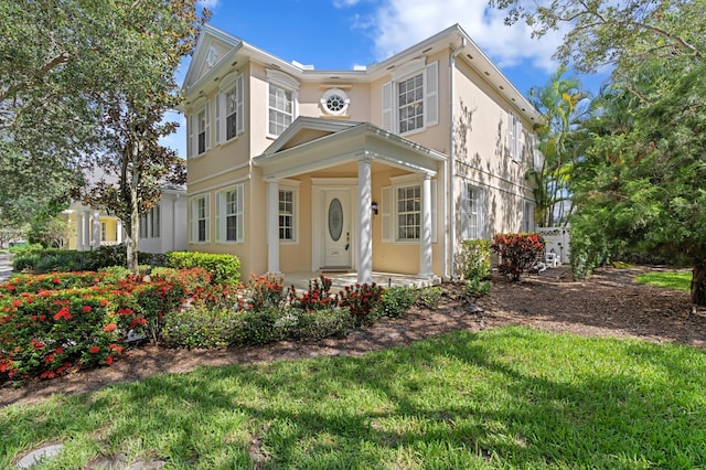 240 Honeysuckle Dr, Jupiter, FL 33458 - view of front of property with stucco siding and a front lawn