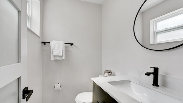 218 NE 10th St, Delray Beach, FL 33444 - bathroom featuring vanity and toilet