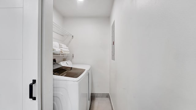 218 NE 10th St, Delray Beach, FL 33444 - laundry area with independent washer and dryer and tile patterned floors