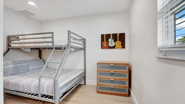 218 NE 10th St, Delray Beach, FL 33444 - bedroom with light wood-style floors and recessed lighting