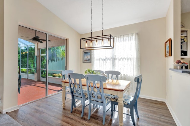 352 NW Granville St, Port Saint Lucie, FL 34986 - dining space with wood finished floors, a ceiling fan, and vaulted ceiling