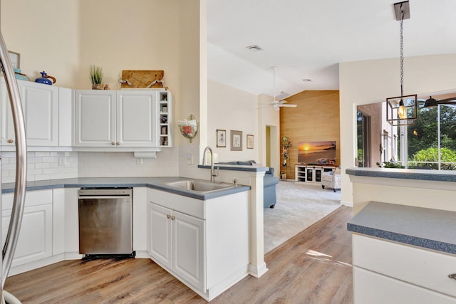 352 NW Granville St, Port Saint Lucie, FL 34986 - kitchen featuring appliances with stainless steel finishes, vaulted ceiling, light wood-type flooring, a peninsula, and ceiling fan