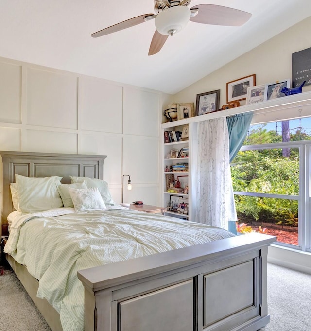 352 NW Granville St, Port Saint Lucie, FL 34986 - bedroom featuring light colored carpet, vaulted ceiling, ceiling fan, and a decorative wall