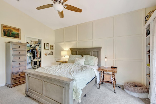 352 NW Granville St, Port Saint Lucie, FL 34986 - bedroom featuring light carpet, a decorative wall, ceiling fan, lofted ceiling, and a spacious closet