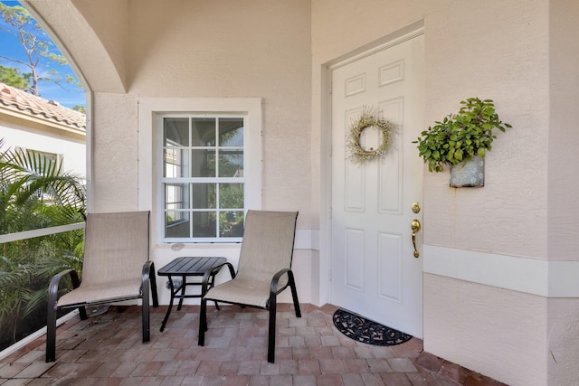 352 NW Granville St, Port Saint Lucie, FL 34986 - view of exterior entry featuring stucco siding