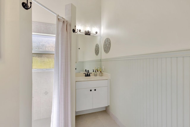 352 NW Granville St, Port Saint Lucie, FL 34986 - full bathroom featuring vanity, tile patterned floors, and tiled shower