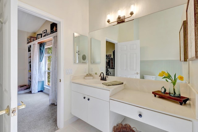 352 NW Granville St, Port Saint Lucie, FL 34986 - bathroom with vanity and vaulted ceiling