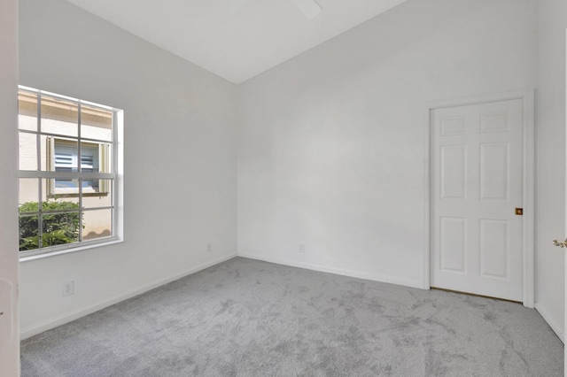 352 NW Granville St, Port Saint Lucie, FL 34986 - unfurnished room with healthy amount of natural light, carpet flooring, and vaulted ceiling