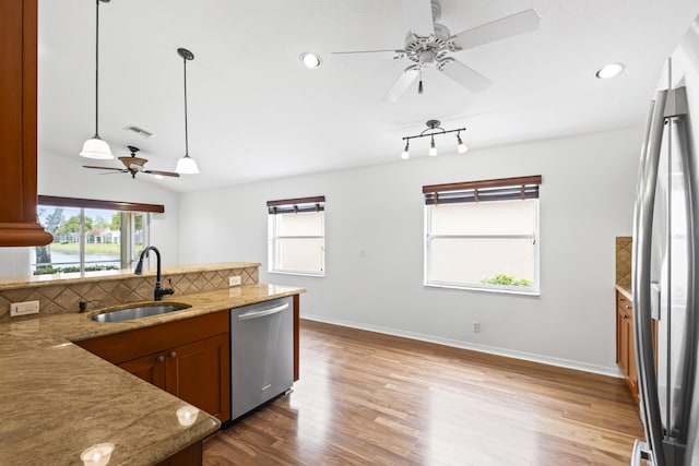 7117 Treviso Ln, Boynton Beach, FL 33472 - kitchen featuring appliances with stainless steel finishes, ceiling fan, wood finished floors, recessed lighting, and decorative backsplash