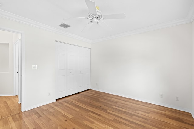 7117 Treviso Ln, Boynton Beach, FL 33472 - unfurnished bedroom with light wood-style flooring, ornamental molding, a closet, and ceiling fan