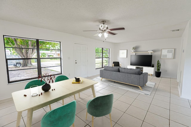 706 Azalea Ave, Fort Pierce, FL 34982 - living room featuring light tile patterned floors, a ceiling fan, and a textured ceiling