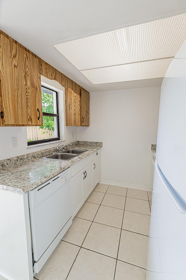 706 Azalea Ave, Fort Pierce, FL 34982 - kitchen featuring white appliances, light countertops, light tile patterned floors, and white cabinetry