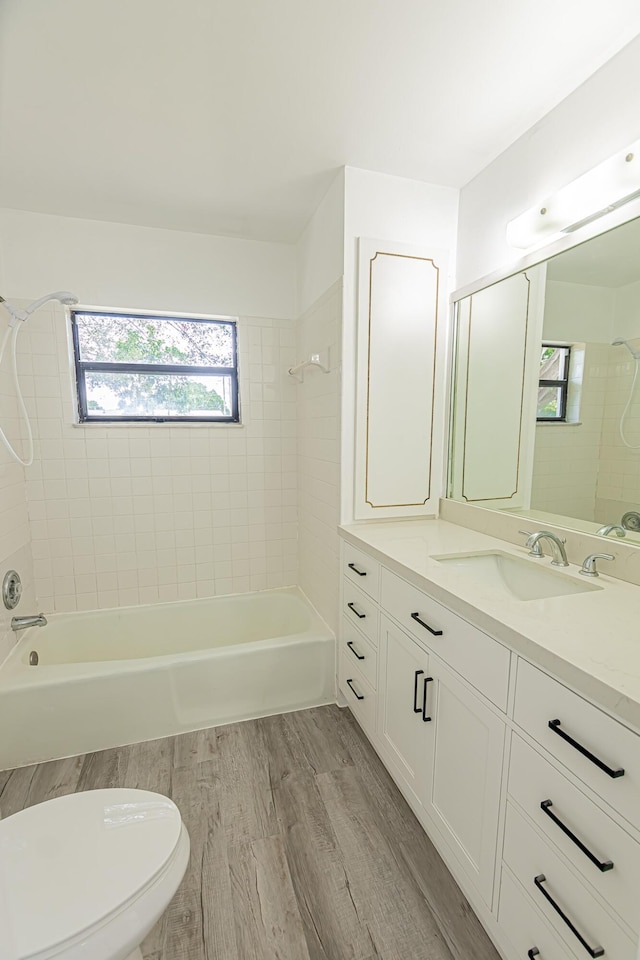 706 Azalea Ave, Fort Pierce, FL 34982 - full bathroom with vanity, shower / tub combination, and wood finished floors