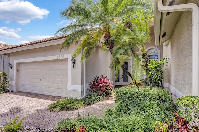 6496 San Michel Way, Delray Beach, FL 33484 - garage with french doors and driveway