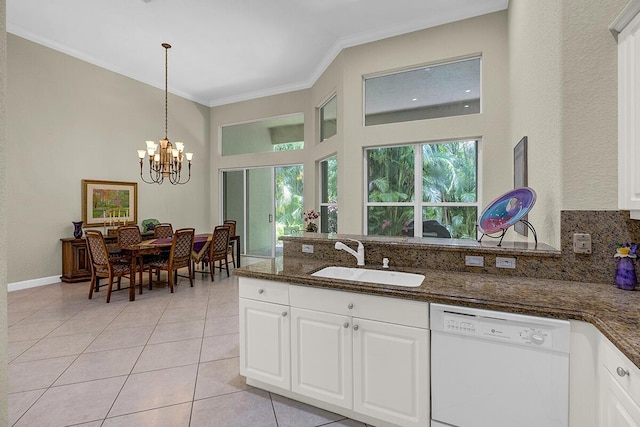 6496 San Michel Way, Delray Beach, FL 33484 - kitchen with dishwasher, crown molding, dark stone countertops, light tile patterned floors, and white cabinetry