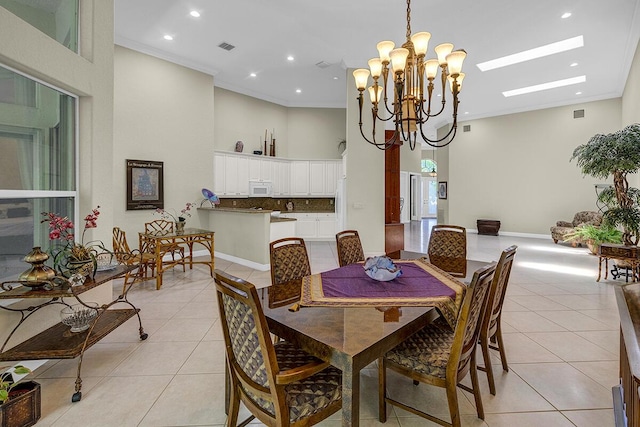 6496 San Michel Way, Delray Beach, FL 33484 - dining area with light tile patterned floors, a chandelier, ornamental molding, recessed lighting, and a skylight