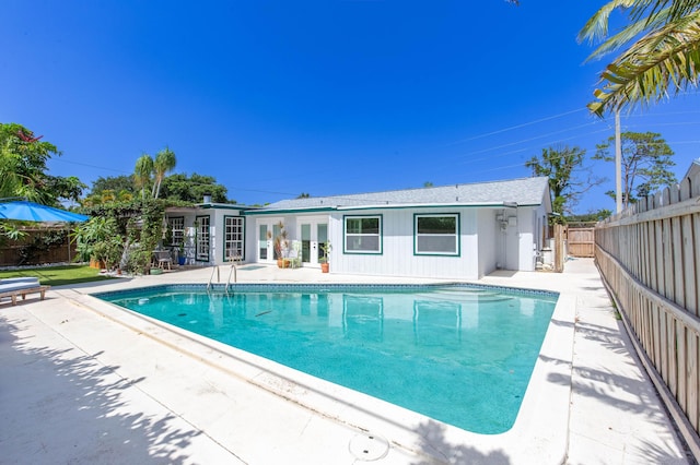 12069 Easterly Ave, Palm Beach Gardens, FL 33410 - view of pool featuring a patio, a fenced backyard, and french doors