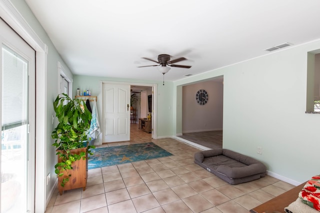 12069 Easterly Ave, Palm Beach Gardens, FL 33410 - foyer with ceiling fan and light tile patterned flooring