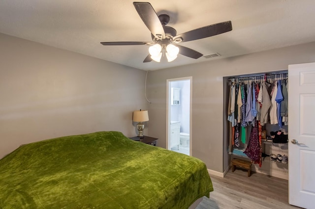 12069 Easterly Ave, Palm Beach Gardens, FL 33410 - bedroom with light wood-style floors, connected bathroom, ceiling fan, and a closet