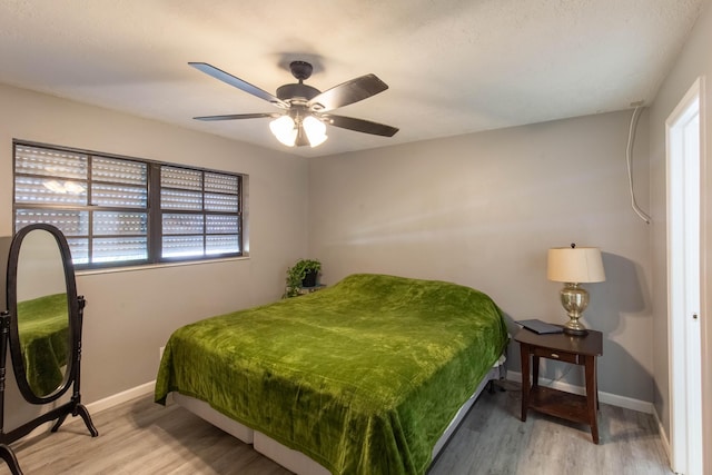 12069 Easterly Ave, Palm Beach Gardens, FL 33410 - bedroom with wood finished floors and a ceiling fan