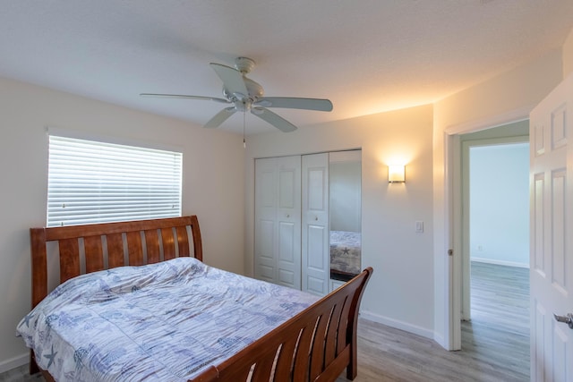 12069 Easterly Ave, Palm Beach Gardens, FL 33410 - bedroom featuring light wood finished floors, a closet, and a ceiling fan