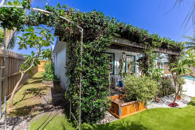 12069 Easterly Ave, Palm Beach Gardens, FL 33410 - view of property exterior with a fenced backyard