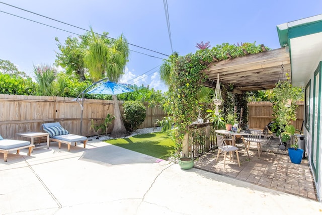 12069 Easterly Ave, Palm Beach Gardens, FL 33410 - fenced backyard with a patio and outdoor dining area