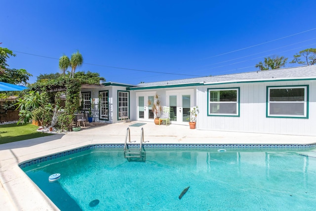 12069 Easterly Ave, Palm Beach Gardens, FL 33410 - swimming pool featuring french doors and a patio area