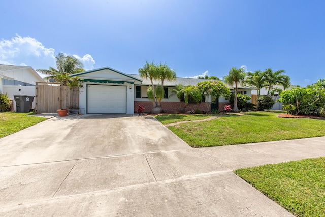 12069 Easterly Ave, Palm Beach Gardens, FL 33410 - ranch-style home featuring an attached garage, concrete driveway, brick siding, and a gate