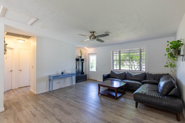 12069 Easterly Ave, Palm Beach Gardens, FL 33410 - living area featuring wood finished floors, attic access, ceiling fan, and a textured ceiling