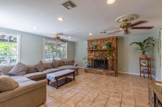 12069 Easterly Ave, Palm Beach Gardens, FL 33410 - living room featuring a ceiling fan, healthy amount of natural light, light tile patterned floors, a fireplace, and recessed lighting