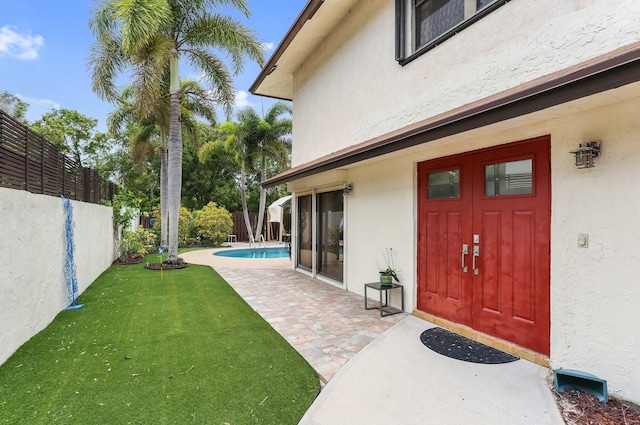 368 SW 29th Ave, Delray Beach, FL 33445 - view of exterior entry with stucco siding