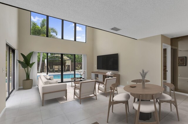 368 SW 29th Ave, Delray Beach, FL 33445 - spare room with a textured ceiling, a high ceiling, and light tile patterned floors