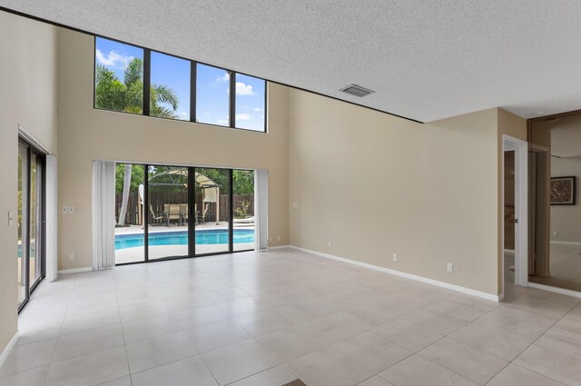368 SW 29th Ave, Delray Beach, FL 33445 - foyer featuring light tile patterned floors and a textured ceiling
