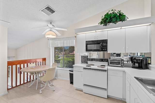 10263 N Circle Lake Dr Unit 201, Boynton Beach, FL 33437 - kitchen featuring black microwave, white range with electric stovetop, lofted ceiling, a textured ceiling, and light countertops