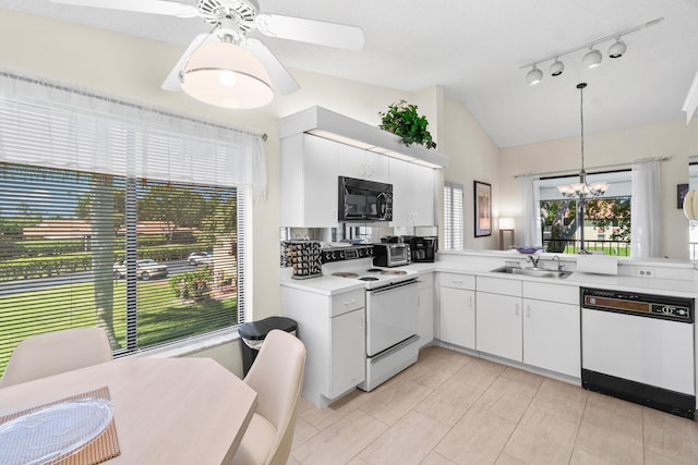 10263 N Circle Lake Dr Unit 201, Boynton Beach, FL 33437 - kitchen featuring white appliances, light countertops, vaulted ceiling, a chandelier, and pendant lighting