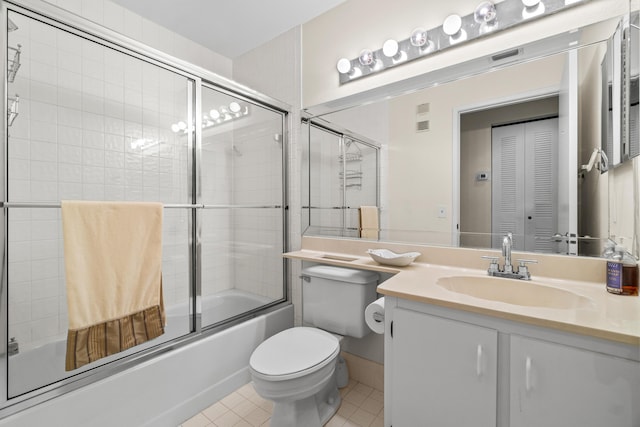 10263 N Circle Lake Dr Unit 201, Boynton Beach, FL 33437 - bathroom featuring tile patterned floors, combined bath / shower with glass door, and vanity