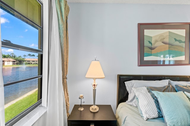 10263 N Circle Lake Dr Unit 201, Boynton Beach, FL 33437 - bedroom with multiple windows and a water view