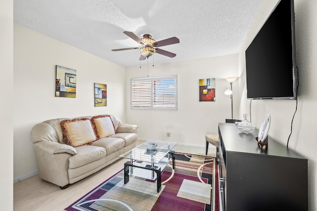 10263 N Circle Lake Dr Unit 201, Boynton Beach, FL 33437 - living room featuring ceiling fan and a textured ceiling