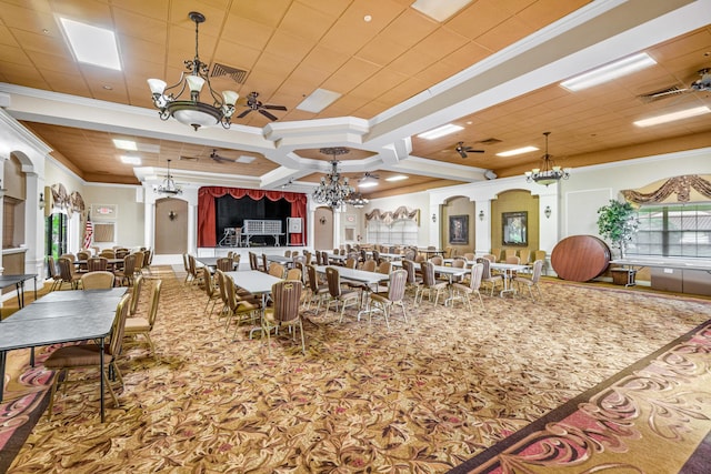 10263 N Circle Lake Dr Unit 201, Boynton Beach, FL 33437 - carpeted dining space with crown molding, a chandelier, and decorative columns
