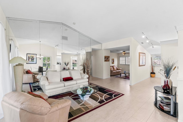 10263 N Circle Lake Dr Unit 201, Boynton Beach, FL 33437 - living room with vaulted ceiling, ceiling fan, and rail lighting