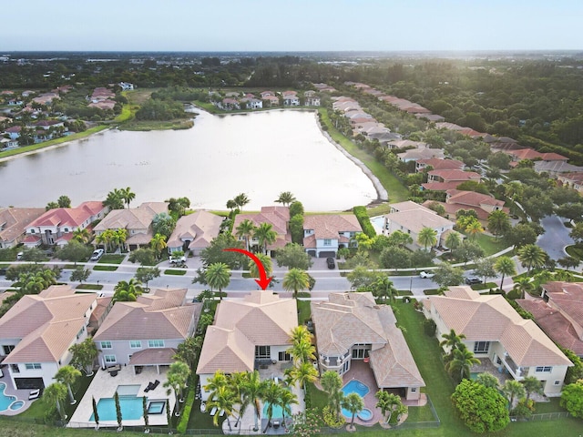 718 Edgebrook Ln, West Palm Beach, FL 33411 - aerial perspective of suburban area featuring a pool and a nearby body of water
