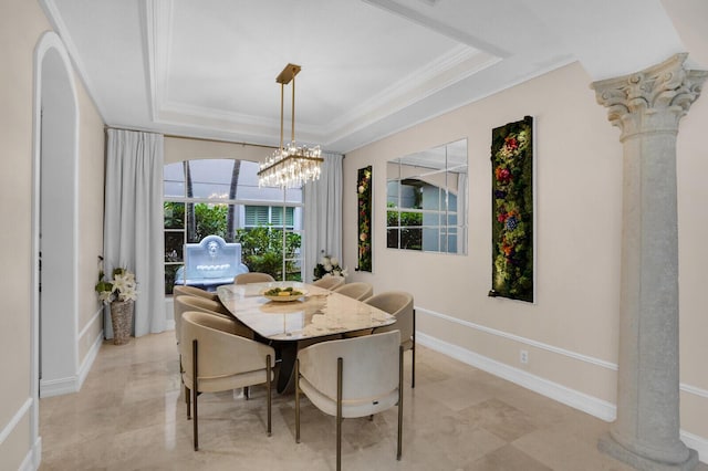 718 Edgebrook Ln, West Palm Beach, FL 33411 - dining space with a tray ceiling, crown molding, ornate columns, and a chandelier