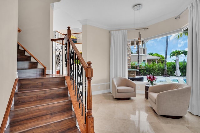 718 Edgebrook Ln, West Palm Beach, FL 33411 - staircase featuring baseboards and crown molding