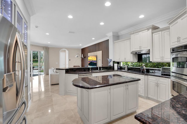 718 Edgebrook Ln, West Palm Beach, FL 33411 - kitchen featuring appliances with stainless steel finishes, crown molding, a peninsula, recessed lighting, and under cabinet range hood