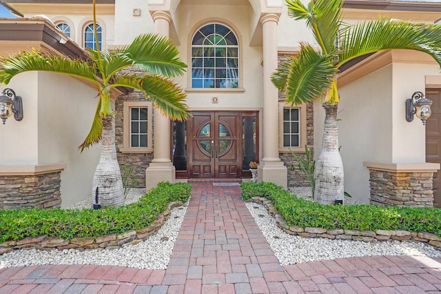 718 Edgebrook Ln, West Palm Beach, FL 33411 - entrance to property with stone siding and stucco siding