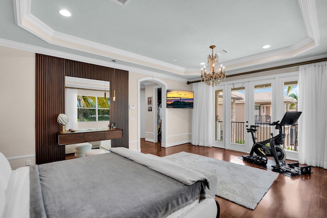 718 Edgebrook Ln, West Palm Beach, FL 33411 - bedroom with a tray ceiling, arched walkways, crown molding, access to outside, and wood finished floors